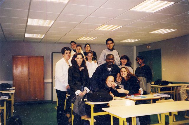 Leading a painting workshop for students in France.