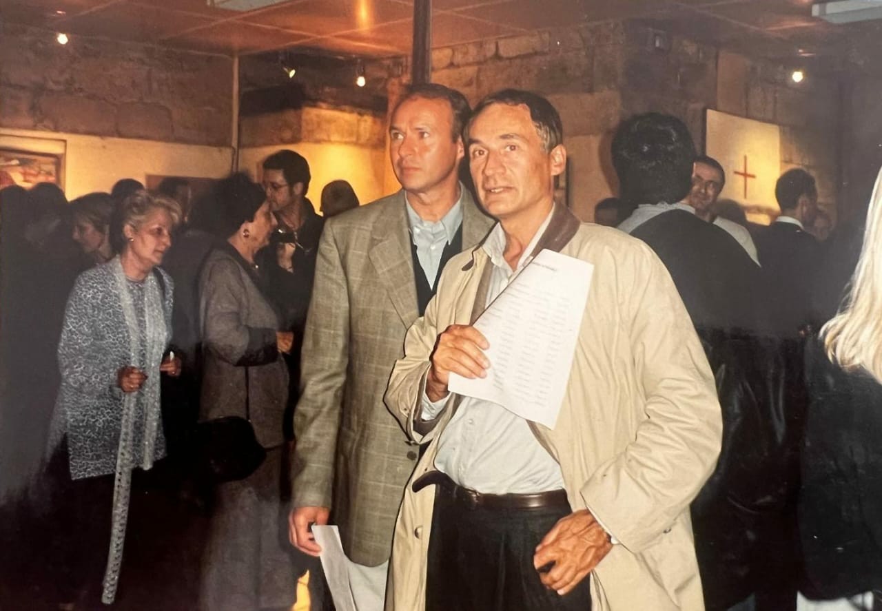 At an exhibition opening reception.